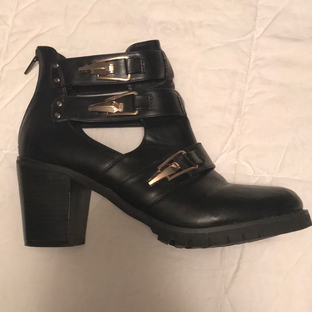 Black booties with gold buckles